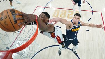 Jun 4, 2023; Denver, CO, USA; Miami Heat center Bam Adebayo (13) dunks against Denver Nuggets forward Michael Porter Jr. (1) during the second half in game two of the 2023 NBA Finals at Ball Arena. Mandatory Credit: Mark J. Terrill/Pool Photo-USA TODAY Sports