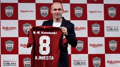 Spain midfielder Andres Iniesta poses with his T-shirt at a news conference to announce signing for J-League side Vissel Kobe in Tokyo, Japan May 24, 2018.  REUTERS/Toru Hanai