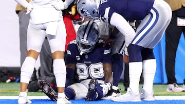 DETROIT, MICHIGAN - DECEMBER 04: Dak Prescott #4 checks on CeeDee Lamb #88 of the Dallas Cowboys after he dropped a ball in the end zone and left the game against the Detroit Lions during the third quarter at Ford Field on December 04, 2025 in Detroit, Michigan. Gregory Shamus/Getty Images/AFP (Photo by Gregory Shamus / GETTY IMAGES NORTH AMERICA / Getty Images via AFP)