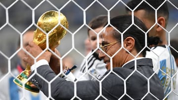 Nusret Goekce, nicknamed Salt Bae, admires the FIFA World Cup Qatar 2022 Winner's Trophy