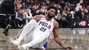 Apr 20, 2023; Brooklyn, New York, USA; Philadelphia 76ers center Joel Embiid (21) grimaces after falling to the floor during game three of the 2023 NBA playoffs against the Brooklyn Nets at Barclays Center. Mandatory Credit: Wendell Cruz-USA TODAY Sports