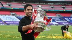 Arsenal&#039;s Spanish head coach Mikel Arteta holds the winner&#039;s trophy as the team celebrates victory after the English FA Cup final football match between Arsenal and Chelsea at Wembley Stadium in London, on August 1, 2020. - Arsenal won the match