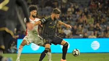 Aug 13, 2024; Los Angeles, California, USA; Los Angeles FC forward Olivier Giroud (9) is defended by San Jose Earthquakes defender Rodrigues (26) in the second half at BMO Stadium. Mandatory Credit: Jayne Kamin-Oncea-USA TODAY Sports