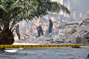 Rescuers work after an explosion in the Saratoga Hotel in Havana