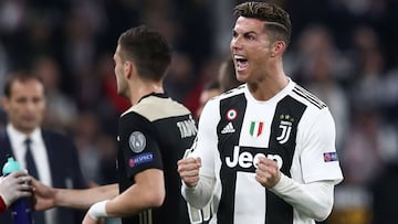Juventus&#039; Portuguese forward Cristiano Ronaldo celebrates after opening the scoring during the UEFA Champions League quarter-final second leg football match Juventus vs Ajax Amsterdam on April 16, 2019 at the Juventus stadium in Turin. (Photo by Isab