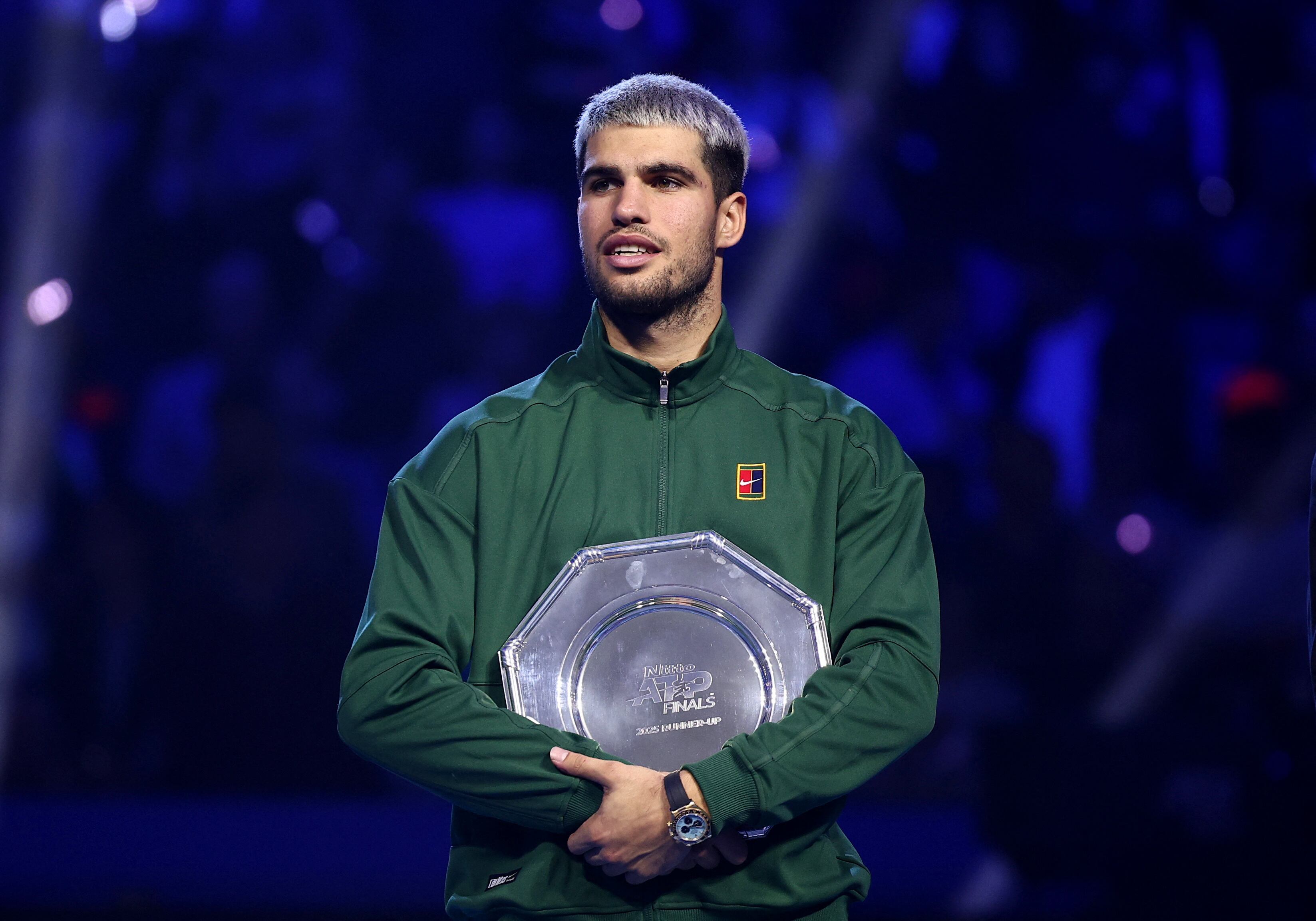Tennis - ATP Finals - Turin - Palasport Olimpico, Turin, Italy - November 16, 2025 Spain's Carlos Alcaraz with the runners up trophy after losing the final against Italy's Jannik Sinner REUTERS/Guglielmo Mangiapane
