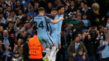 MANCHESTER, ENGLAND - FEBRUARY 21:  Sergio Aguero of Manchester City celebrates with John Stones and Leroy Sane after scoring his team&#039;s third goal to make the score 3-3 during the UEFA Champions League Round of 16 first leg match between Manchester City FC and AS Monaco at Etihad Stadium on February 21, 2017 in Manchester, United Kingdom.  (Photo by Matthew Ashton - AMA/Getty Images)