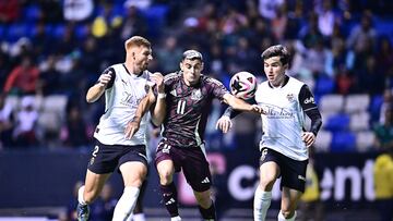 Maximiliano Caufriez (L) of Valencia fights for the ball with German Berterame (R) of Mexico during the game international friendly between Mexican National team (Mexico) and Valencia C.F at Cuauhtemoc Stadium, on October 12, 2024, In Puebla, Mexico.