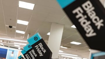 Black Friday sales signs are posted at a Target store in Rockville, Maryland, on November 25, 2022 . - With inflation on the rise, retailers are expecting that many shoppers will be looking for especially good deals as discretionary spending falls. (Photo by SAMUEL CORUM / AFP) (Photo by SAMUEL CORUM/AFP via Getty Images)