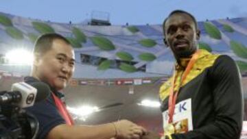Usain Bolt y Song Tao.