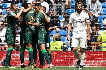 Nacho Fernández (right) reacts as Real Betis' players celebrate their second goal against Real Madrid on Sunday.