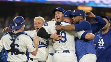 Oct 11, 2024; Los Angeles, California, USA; Los Angeles Dodgers pitcher Blake Treinen (49) and designated hitter Shohei Ohtani (17) and outfielder Teoscar Hernandez (37) celebrate with teammates after defeating the San Diego Padres during game five of the NLDS for the 2024 MLB Playoffs at Dodger Stadium. Mandatory Credit: Jayne Kamin-Oncea-Imagn Images