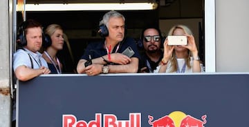 Manchester United manager Jose Mourinho of Portugal watches the action from the Red Bull Racing garage with Declan Donnelly during qualifying for the Monaco Formula One Grand Prix at Circuit de Monaco on May 27, 2017 in Monte-Carlo, Monaco.