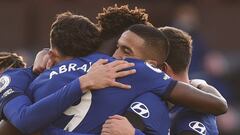 Chelsea players celebrate with Hakim Ziyech, centre right, after he scored his side&#039;s opening goal during an English Premier League soccer match between Burnley and Chelsea at the Turf Moor stadium in Burnley, England, Saturday Oct. 31, 2020. (Oli Sc