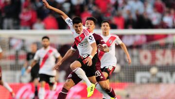 BUENOS AIRES, ARGENTINA - AUGUST 04:Exequiel Palacios of River Plate fights for the ball with Carlos Auzqui of Lanus during a match between River Plate and Lan&uacute;s as part of Superliga Argentina 2019/20 at Estadio Monumental Antonio Vespucio Liberti 