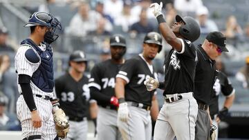 NEW YORK, NEW YORK - APRIL 14:   Tim Anderson #7 of the Chicago White Sox celebrates his fourth inning grand slam home run with his teammates as Kyle Higashioka #66 of the New York Yankees looks on at Yankee Stadium on April 14, 2019 in the Bronx borough of New York City. (Photo by Jim McIsaac/Getty Images)