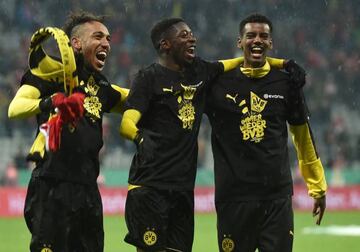 Dortmund's striker Pierre-Emerick Aubameyang, midfielder Ousmane Dembele and striker Alexander Isak celebrate after the German Cup DFB Pokal semifinal.