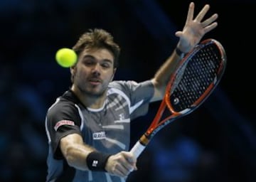 Switzerland\x92s Stan Wawrinka plays a return to Croatia\x92s Marin Cilic, during their singles ATP World Tour Finals tennis match at the O2 Arena in London, Friday, Nov. 14, 2014. (AP Photo/Kirsty Wigglesworth)