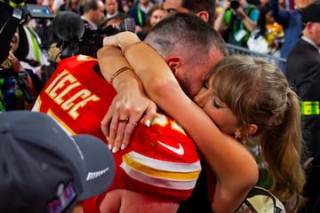 Travis Kelce celebrates with Taylor Swift after winning Super Bowl LVIII.