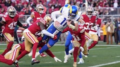 Los Angeles Rams quarterback Carson Wentz (11) dives for a touchdown against San Francisco 49ers cornerback Samuel Womack III (left) and safety Tayler Hawkins (41).