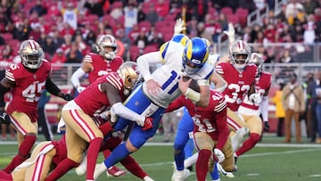 Jan 7, 2024; Santa Clara, California, USA; Los Angeles Rams quarterback Carson Wentz (11) dives for a touchdown against San Francisco 49ers cornerback Samuel Womack III (left) and safety Tayler Hawkins (41) during the fourth quarter at Levi's Stadium. Mandatory Credit: Darren Yamashita-USA TODAY Sports