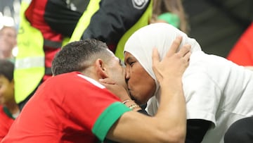 AL RAYYAN, QATAR - DECEMBER 06: Achraf Hakimi of Morocco kisses a lady in the stands following the penalty shoot out victory in the FIFA World Cup Qatar 2022 Round of 16 match between Morocco and Spain at Education City Stadium on December 06, 2022 in Al Rayyan, Qatar. (Photo by Youssef Loulidi/Fantasista/Getty Images)