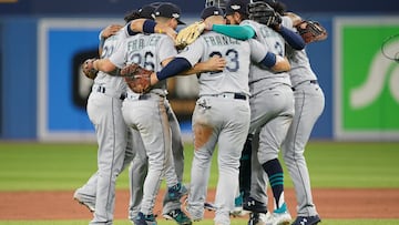 Oct 7, 2022; Toronto, Ontario, CAN; Seattle Mariners players celebrate after defeating the Toronto Blue Jays during game one of the Wild Card series for the 2022 MLB Playoffs at Rogers Centre. Mandatory Credit: Nick Turchiaro-USA TODAY Sports