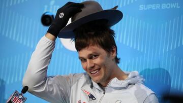 Jan 29, 2018; St. Paul, MN, USA; New England Patriots quarterback Tom Brady (12) puts on a hat during Super Bowl LII Opening Night at Xcel Energy Center. Mandatory Credit: Brace Hemmelgarn-USA TODAY Sports     TPX IMAGES OF THE DAY