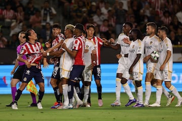 Aug 4, 2024; Carson, California, USA;  Chivas Guadalajara midfielder Fernando Gonzalez (28) and Los Angeles Galaxy midfielder Edwin Cerrillo (20) push each other during the first half at Dignity Health Sports Park. Mandatory Credit: Kiyoshi Mio-USA TODAY Sports