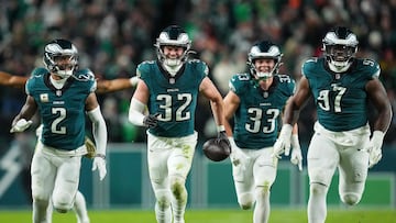 PHILADELPHIA, PENNSYLVANIA - NOVEMBER 14: Reed Blankenship #32 of the Philadelphia Eagles celebrates his interception with teammates Darius Slay Jr. #2, Cooper DeJean #33 and Moro Ojomo #97 as they play the Washington Commanders during the fourth quarter at Lincoln Financial Field on November 14, 2024 in Philadelphia, Pennsylvania. Mitchell Leff/Getty Images/AFP (Photo by Mitchell Leff / GETTY IMAGES NORTH AMERICA / Getty Images via AFP)