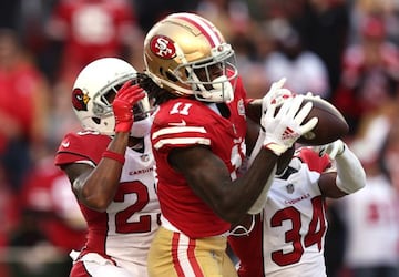 SANTA CLARA, CALIFORNIA - NOVEMBER 07: Brandon Aiyuk #11 of the San Francisco 49ers catches a pass for a touchdown in front of Robert Alford #23 and Jalen Thompson #34 of the Arizona Cardinals during the third quarter at Levi's Stadium on November 07, 202