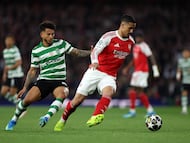 Arsenal's French defender #02 William Saliba is put under pressure by Sporting Lisbon's Colombian striker #97 Luis Suarez during the UEFA Champions League quarter-final, second-leg football match between Arsenal and Sporting Lisbon at the Emirates Stadium in north London on April 15, 2026. (Photo by Adrian Dennis / AFP)