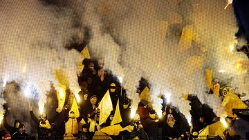 Soccer Football - DFB Cup - Round of 16 - VfL Bochum v Borussia Dortmund - Ruhrstadion, Bochum, Germany - February 8, 2023 Borussia Dortmund fans with flares in the stands REUTERS/Wolfgang Rattay DFB REGULATIONS PROHIBIT ANY USE OF PHOTOGRAPHS AS IMAGE SEQUENCES AND/OR QUASI-VIDEO.