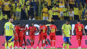 Qadsiah's players celebrate their second goal during the Saudi Pro League football match between Al-Nassr and Al-Qadsiah at Al-Awwal Park in Riyadh on November 22, 2024. (Photo by Fayez NURELDINE / AFP)