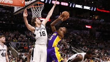 Apr 5, 2017; San Antonio, TX, USA; Los Angeles Lakers power forward Thomas Robinson (15) shoots the ball as San Antonio Spurs center Pau Gasol (16) defends during the second half at AT&T Center. The Lakers won 102-95. Mandatory Credit: Soobum Im-USA TODAY Sports