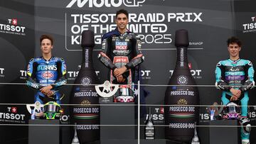 Winner, Liqui Moly Dynavolt Intact GP team's Australian Moto2 rider Senna Agius (C), runner-up, Italtrans Racing Team's Brazilian Moto2 rider Diogo Moreira (L) and third place, CFMOTO Inde Aspar Team's Colombian Moto2 rider David Alonso (R) on the podium after the Moto2 race at the MotoGP British Grand Prix weekend at Silverstone circuit in Northamptonshire, central England, on May 25, 2025. (Photo by Adrian Dennis / AFP) (Photo by ADRIAN DENNIS/AFP via Getty Images)