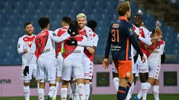 Monaco&#039;s Brazilian defender Caio Henrique (C) congratulates his teammate Monaco&#039;s French forward Wissam Ben Yedder after scoring a goal during the French L1 football match between Montpellier Herault SC and AS Monaco at the Mosson stadium in Mon