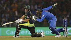 India&#039;s captain and wicketkeeper Mahendra Singh Dhoni runs to field the ball off the bat of Australia&#039;s Aaron Finch.