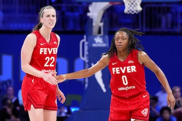 Kelsey Mitchell #0 of the Indiana Fever celebrates scoring with Caitlin Clark #22