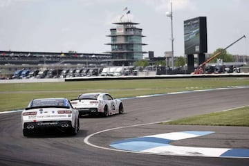 INDIANAPOLIS, INDIANA - JULY 03: AJ Allmendinger, driver of the #16 Digital Ally Body Cameras Chevrolet, leads Ross Chastain, driver of the #10 Chevy Accessories Chevrolet, during practice for the NASCAR Xfinity Series Pennzoil 150 at the Brickyard at Ind