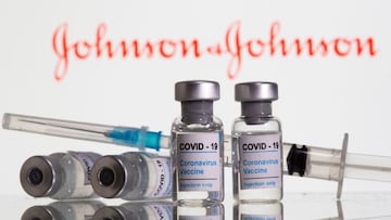 FILE PHOTO: FILE PHOTO: Vials labelled "COVID-19 Coronavirus Vaccine" and syringe are seen in front of a Johnson &J ohnson logo in this illustration taken, February 9, 2021. REUTERS/Dado Ruvic/Illustration/File Photo/File Photo