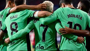 Atletico Madrid's French forward #07 Antoine Griezmann is congratulated teammates for scoring the opening goal during the Spanish Liga football football match between CA Osasuna and Club Atletico de Madrid at El Sadar stadium in Pamplona on September 28, 2023. (Photo by ANDER GILLENEA / AFP)