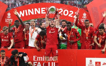 Jordan Henderson of Liverpool raises the trophy during The FA Cup Final match between Chelsea and Liverpool at Wembley Stadium