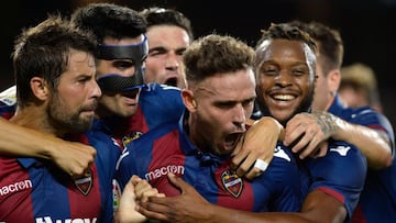 Levante's Spanish forward Roger Marti (C) reacts after scoring a goal during the Spanish league football match between Real Betis and Levante at the Benito Villamarin stadium in Sevilla on August 17, 2018. (Photo by Cristina Quicler / AFP)
