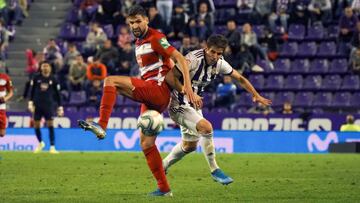 GRAF8122. VALLADOLID, 24/09/2019.- El defensa del Granada Carlos Neva y el centrocampista del VAlladolid Pablo Hervías durante el partido de la sexta jornada de Liga que disputan este martes en el estadio José Zorrilla de Valladolid. EFE/R.G