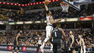 Dec 28, 2018; Indianapolis, IN, USA; Indiana Pacers forward Thaddeus Young (21) dunks against Detroit Pistons guard Reggie Jackson (1) during the 4th quarter at Bankers Life Fieldhouse. Mandatory Credit: Brian Spurlock-USA TODAY Sports
