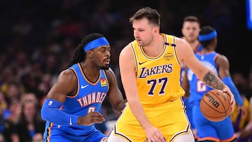OKLAHOMA CITY, OKLAHOMA - APRIL 8: Luka Doncic #77 of the Los Angeles Lakers handles the ball in front of Luguentz Dort #5 of the Oklahoma City Thunder during the first half at Paycom Center on April 8, 2025 in Oklahoma City, Oklahoma. NOTE TO USER: User expressly acknowledges and agrees that, by downloading and or using this photograph, User is consenting to the terms and conditions of the Getty Images License Agreement. Joshua Gateley/Getty Images/AFP (Photo by Joshua Gateley / GETTY IMAGES NORTH AMERICA / Getty Images via AFP)