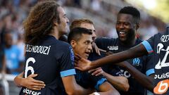 Marseille's Chilean forward Alexis Sanchez (C) celebrates with Marseille's French midfielder Matteo Guendouzi (L) and teammates after scoring his team's second goal during the French L1 football match between AJ Auxerre and Olympique Marseille (OM) at Stade de l'Abbe-Deschamps in Auxerre, central France on September 3, 2022. (Photo by FRANCK FIFE / AFP)