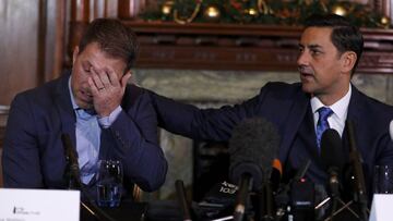 Former footballer Andy Woodward consoles Steve Walters at the launch of The Offside Trust, an independent group set up to support players and their families who have suffered abuse