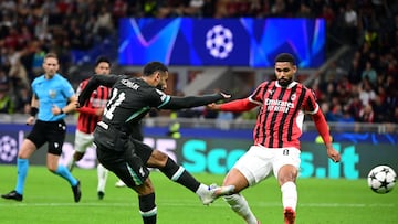 Liverpool's Egyptian forward #11 Mohamed Salah shoots on target next to AC Milan's English midfielder #08 Ruben Loftus-Cheek (R) during the UEFA Champions League 1st round day 1 football match between AC Milan and Liverpool FC at the San Siro stadium in Milan on September 17, 2024. (Photo by PIERO CRUCIATTI / AFP)